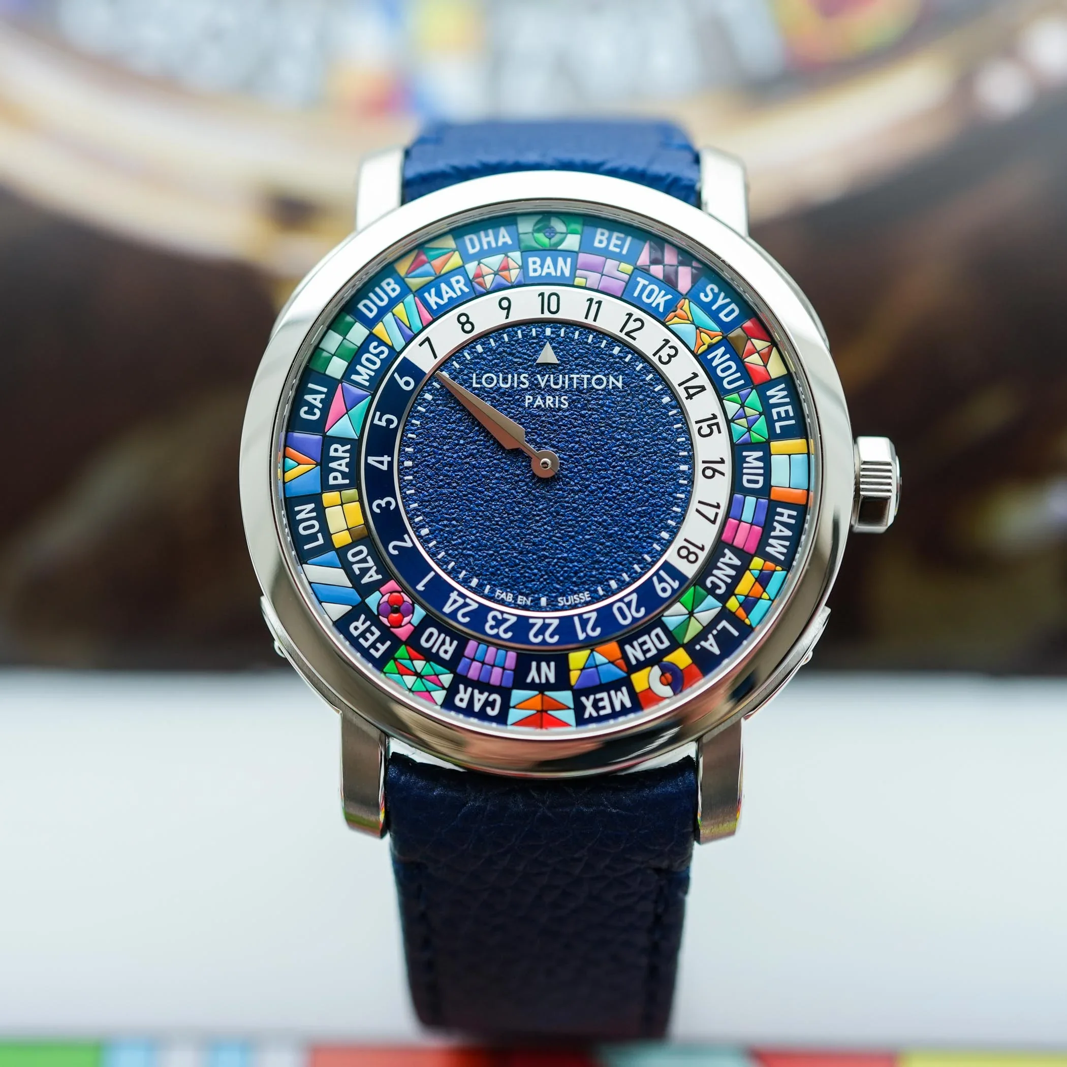 Detailed macro view of hand-painted city flags on the Louis Vuitton Escale Worldtime dial.