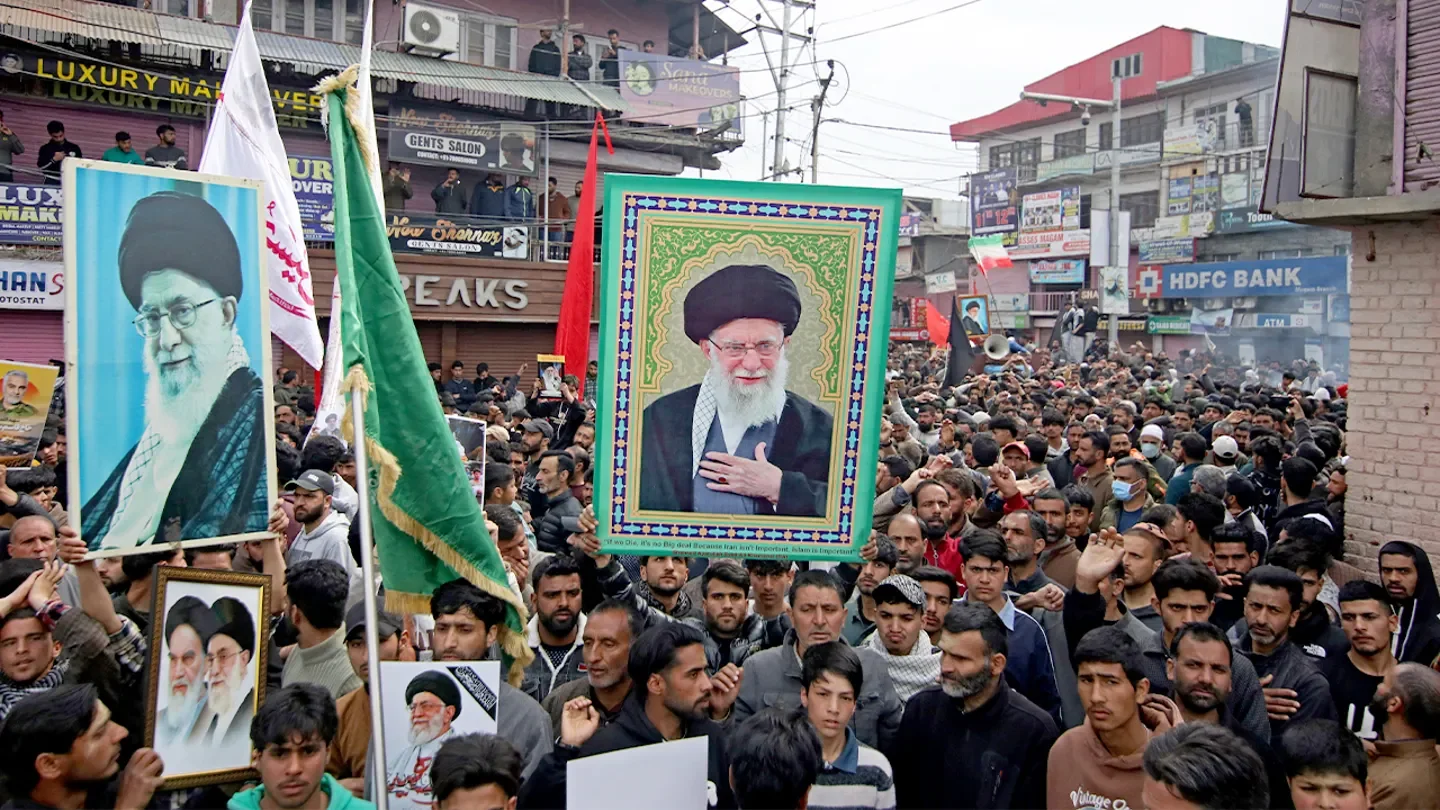 Iranians carry pictures of Ayatollah Ali Khamenei as they march in a protest rally on the fourth day of mourning in Magam, Jammu and Kashmir, on March 4, 2026. (Faisal Khan/Anadolu/Getty Images)