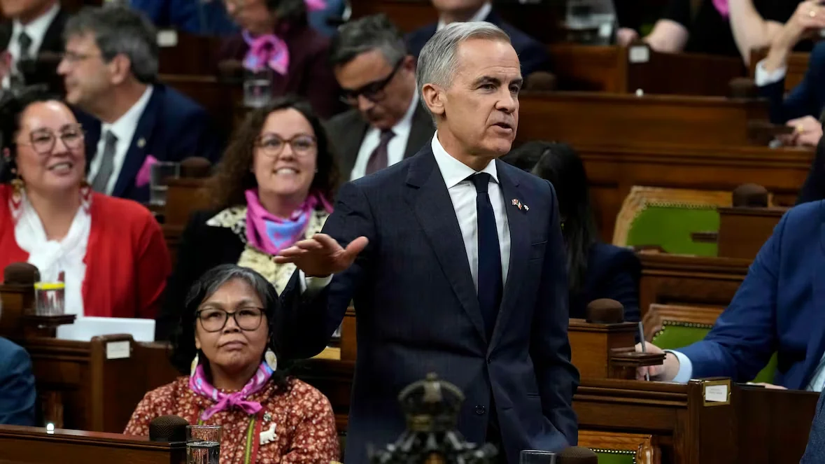 Prime Minister Mark Carney is seen in the House of Commons on Wednesday with his latest floor-crosser, Lori Idlout, seated beside him. (Justin Tang/The Canadian Press)