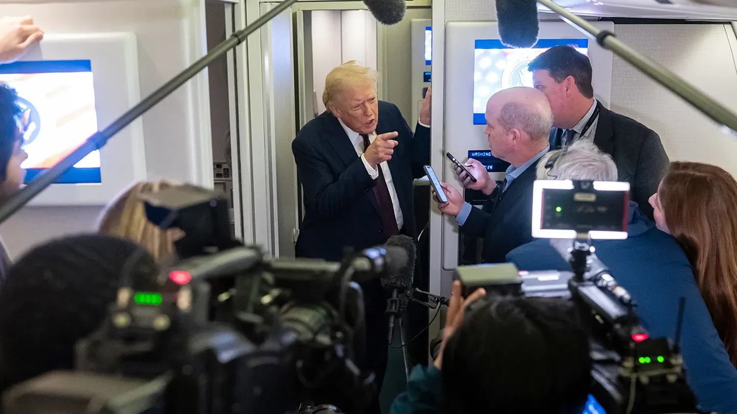 President Donald Trump speaks to members of the media aboard Air Force One, March 15, 2026. (Nathan Howard/Getty Images)