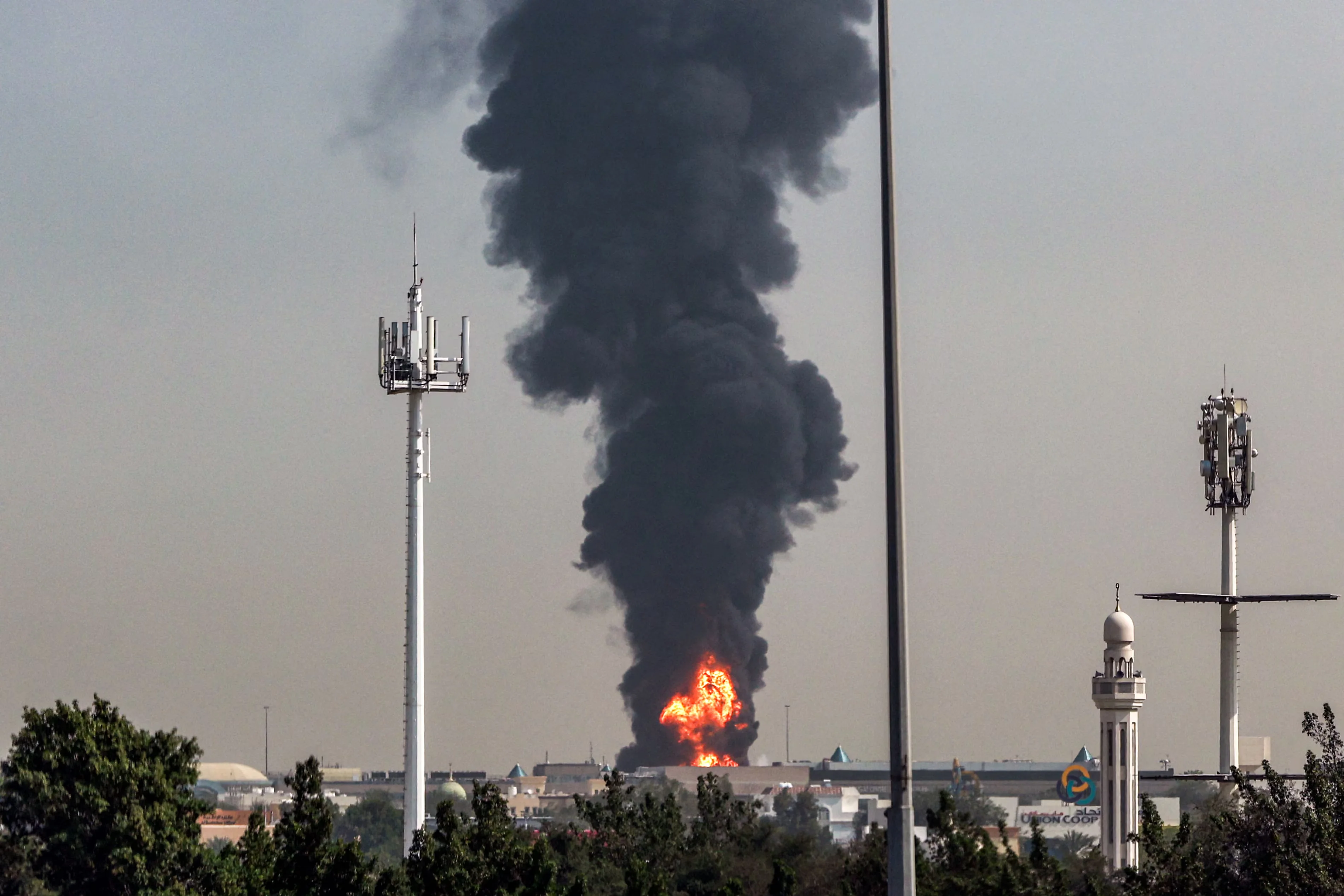 Fire and smoke rise from Dubai’s international airport on Monday after a ‘drone-related incident’. Flights were disrupted. Photograph: AFP/Getty Images