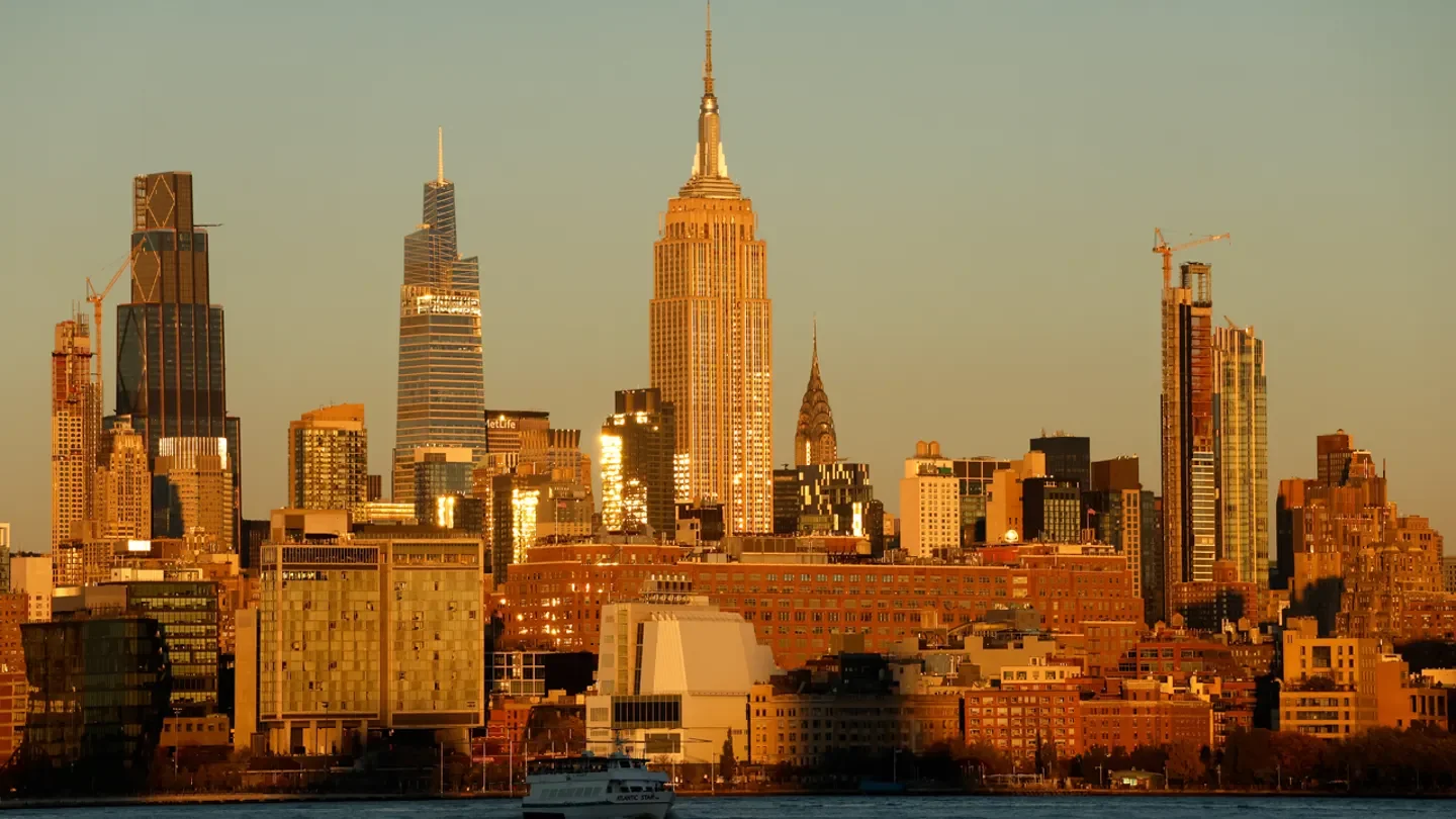 The sun sets on the skyline of midtown Manhattan and the Empire State Building in New York City. (Gary Hershorn/Getty Images)