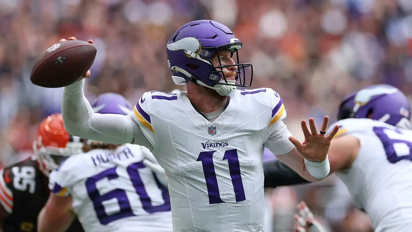 Minnesota Vikings quarterback Carson Wentz (11) passes the ball during the first half of the NFL game between the Minnesota Vikings and the Cleveland Browns at Tottenham Hotspur Stadium in London, England, on Oct. 5, 2025. (AP Photo/Ian Walton)