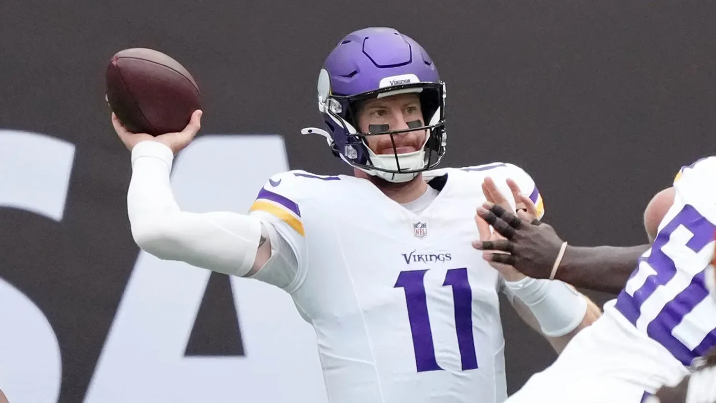 Minnesota Vikings quarterback Carson Wentz (11) passes the ball against the Cleveland Browns during the first quarter of an NFL International Series game at Tottenham Hotspur Stadium in London, England, on Oct. 5, 2025. (Kirby Lee/Imagn Images)