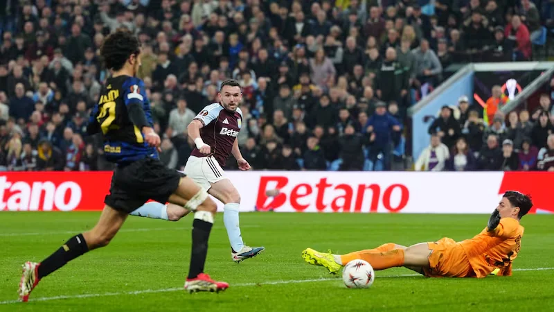 Aston Villa’s John McGinn celebrates victory over Lille .
