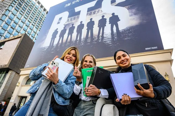 Members of ARMY, BTS' official fandom, pose near Gwanghwamun Square in Seoul, Thursday, two days before the K-pop band’s comeback concert. Korea Times photo by Shim Hyun-chul