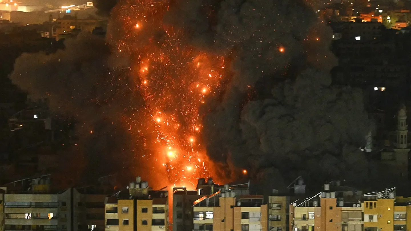 A fireball rises from the site of an Israeli airstrike that targeted an area in Beirut's southern suburbs overnight, March 10 to March 11, 2026.  (Fadel itani / AFP via Getty Images)