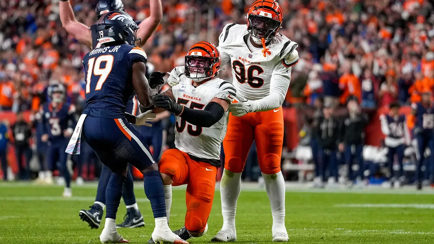 Denver Broncos wide receiver Marvin Mims Jr. (19) helps up Cincinnati Bengals linebacker Logan Wilson (55) as he appears injured in the fourth quarter of the NFL Week 4 "Monday Night Football" game between the Denver Broncos and the Cincinnati Bengals at Empower Field at Mile High in Denver on Monday, Sept. 29, 2025. (Sam Greene/The Enquirer / USA TODAY NETWORK via Imagn Images)