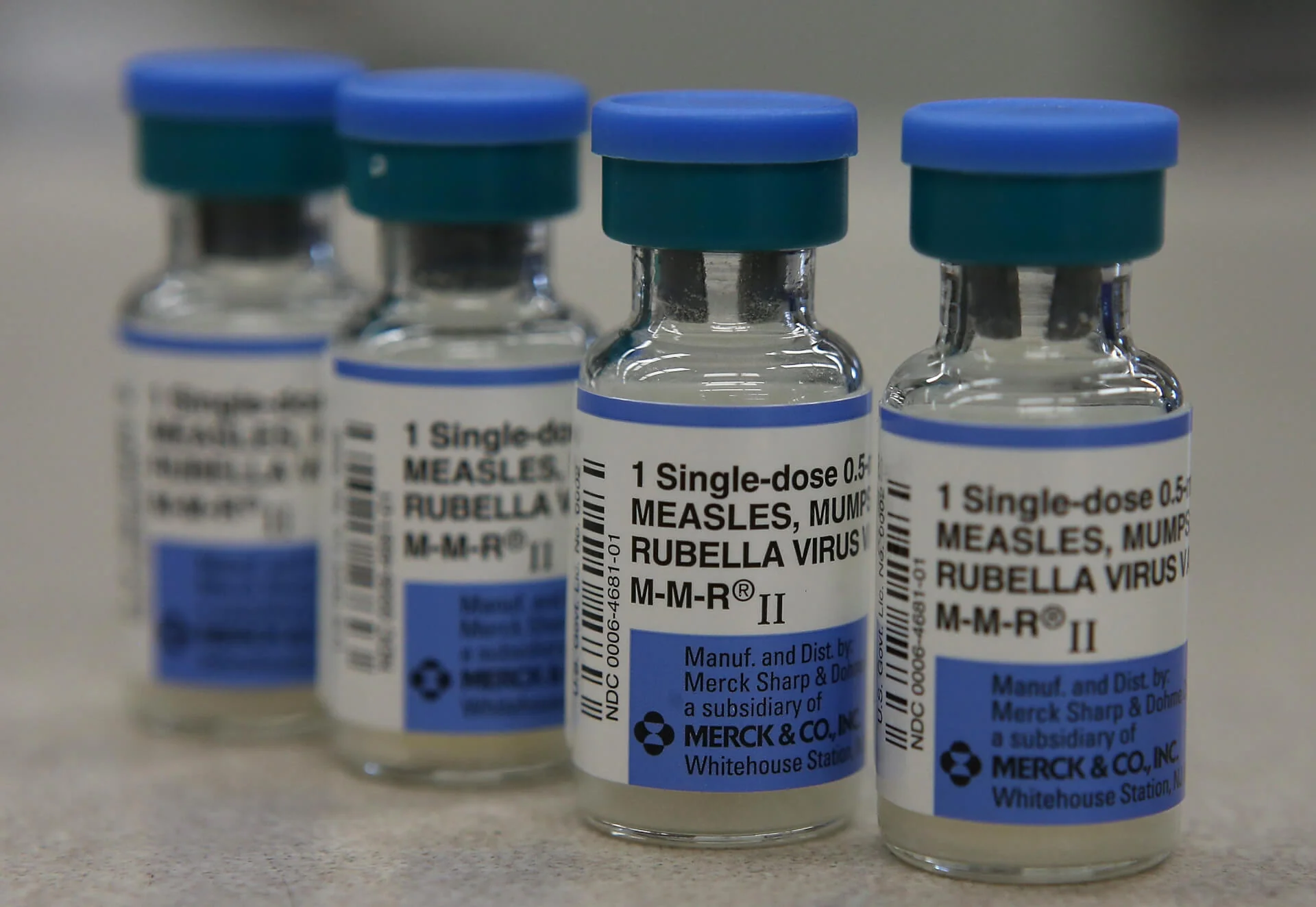 Vials of measles, mumps and rubella vaccine are displayed on a counter at a Walgreens Pharmacy on January 26, 2015 | Photo by Illustration Justin Sullivan/Getty Images