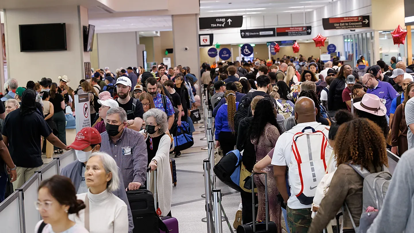 Travelers wait in line at a Transportation Security Administration (TSA) checkpoint at William P. Hobby Airport in Houston, Texas. (Mark Felix/Bloomberg via Getty Images)