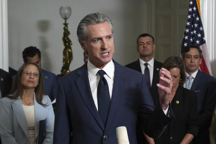 Accompanied by California and Texas lawmakers, California Gov. Gavin Newsom speaks in support of the Texas Democratic lawmakers for their walkout to block a vote on a congressional redistricting plan sought by President Trump, during a news conference in Sacramento, Calif., on Aug. 8.