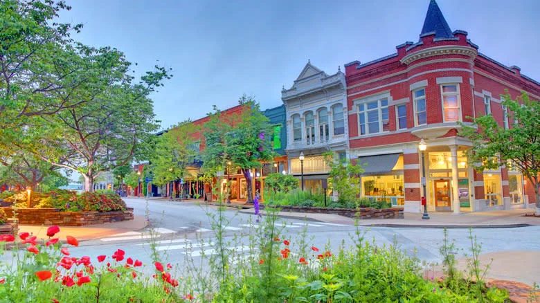 Red building surrounded by greenery and flower beds in downtown Fayetteville - Denistangneyjr/Getty Images