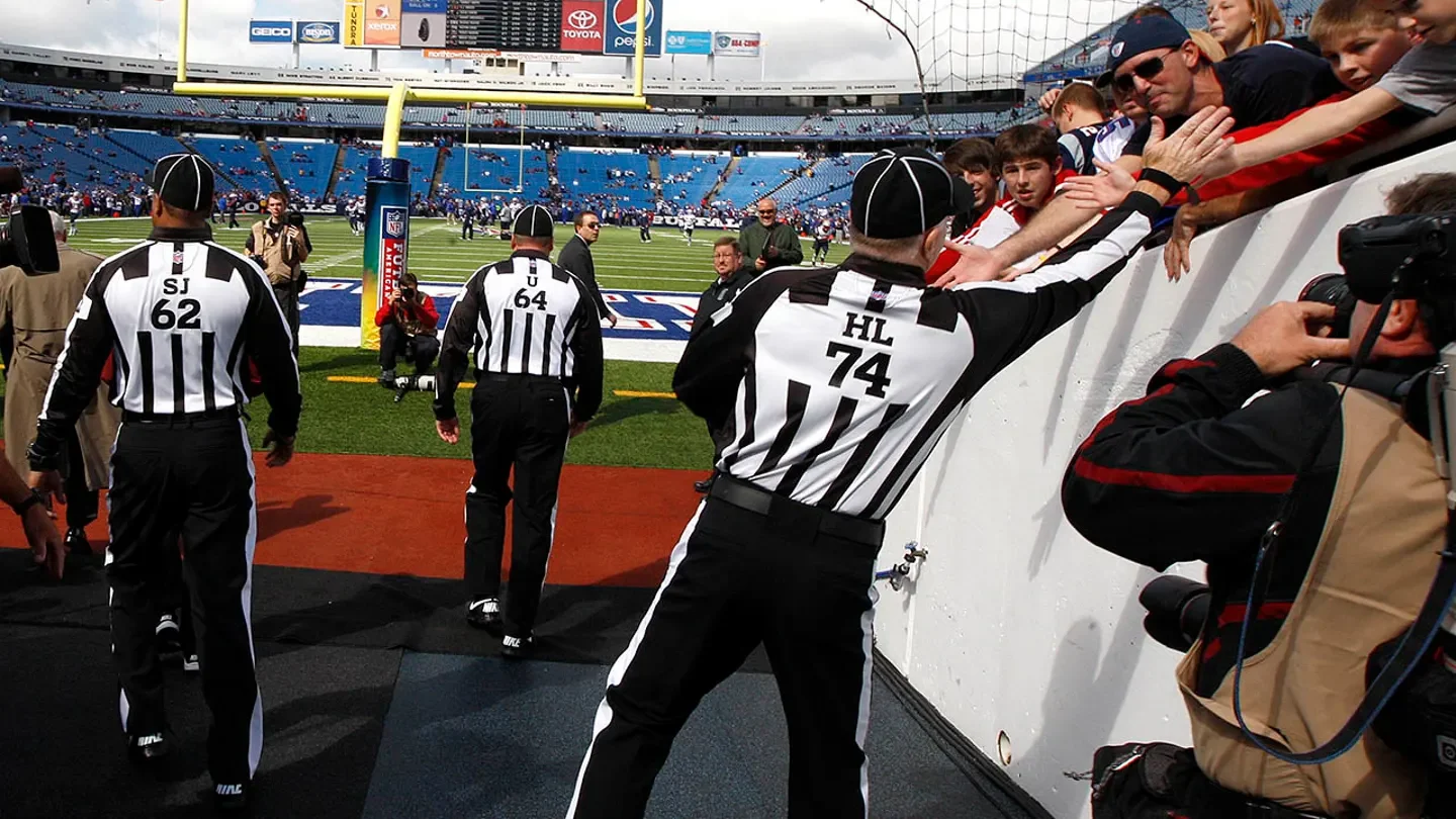 Fans greet the regular referees as they return to the football field ahead of the Patriots taking on the Buffalo Bills at Ralph Wilson Stadium on Sept. 3, 2012 in Buffalo, New York. (Barry Chin/The Boston Globe via Getty Images)