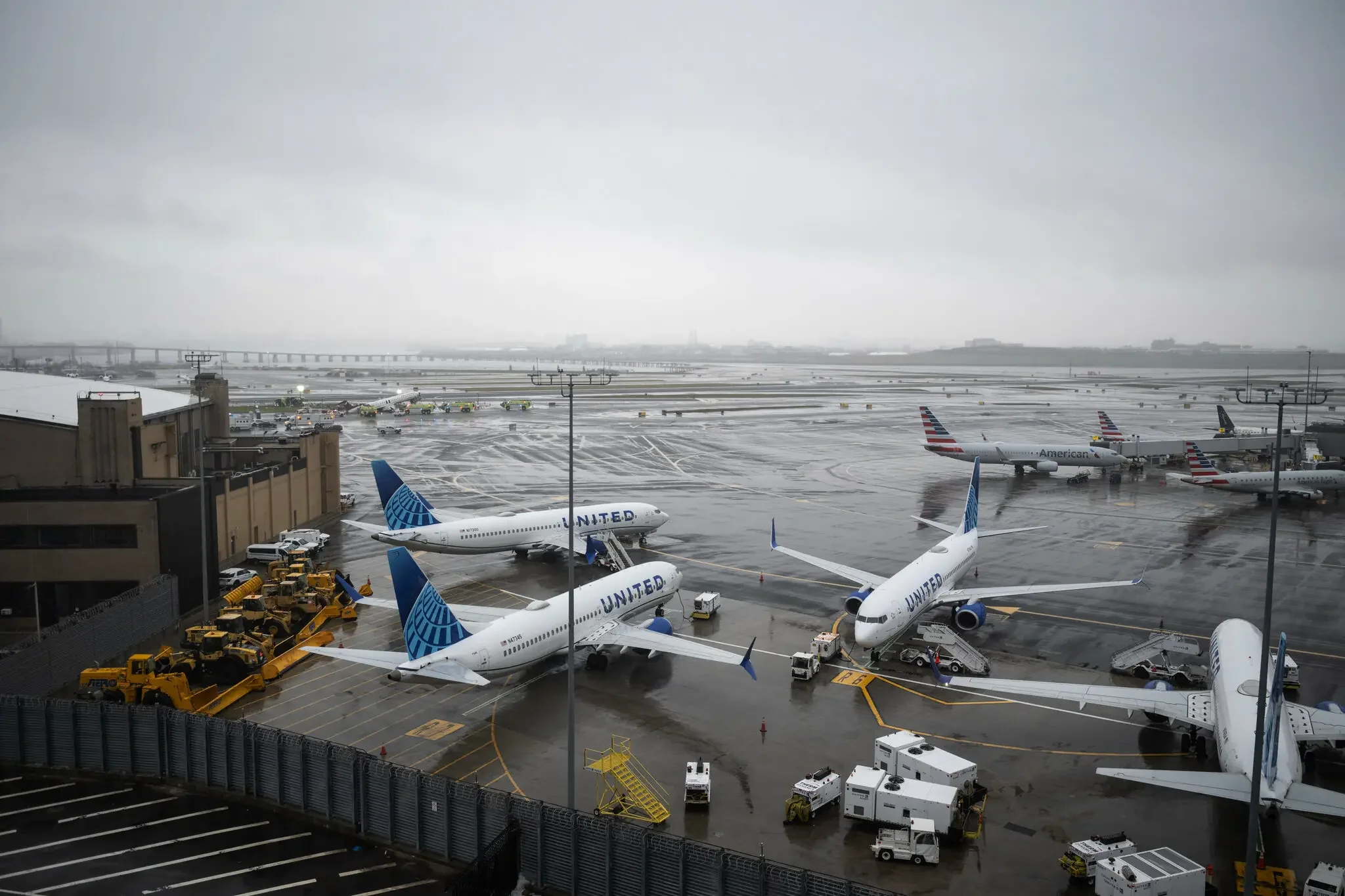 The wreckage of Air Canada plane that had collided with a fire truck on Sunday, remained on a runway at LaGuardia Airport in Queens, New York, on Monday.Credit...Victor J. Blue for The New York Times