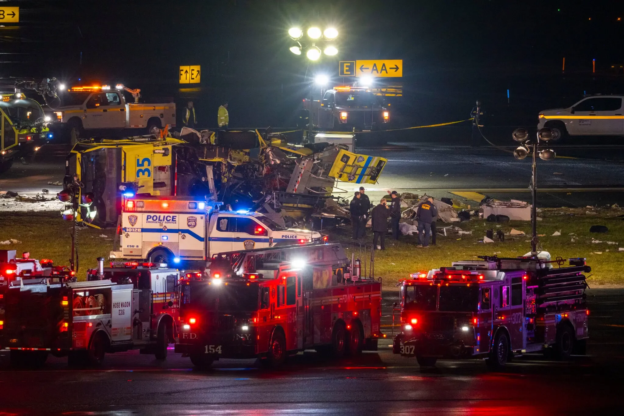 Investigators at the scene of the crash on Monday.Credit...Dakota Santiago for The New York Times