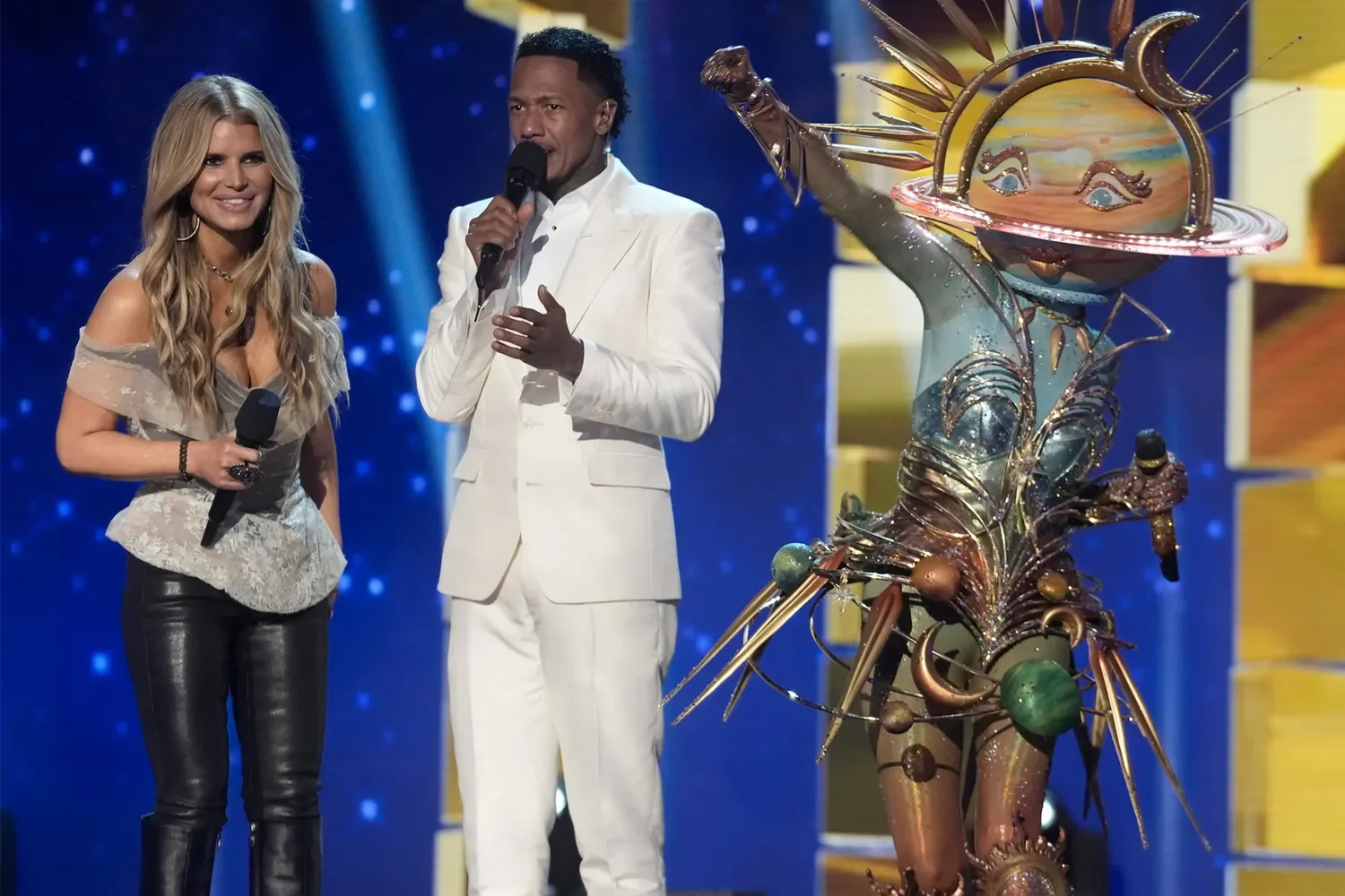 Special guest Jessica Simpson, host Nick Cannon, and Galaxy Girl on 'The Masked Singer'. Credit: Michael Becker/ FOX