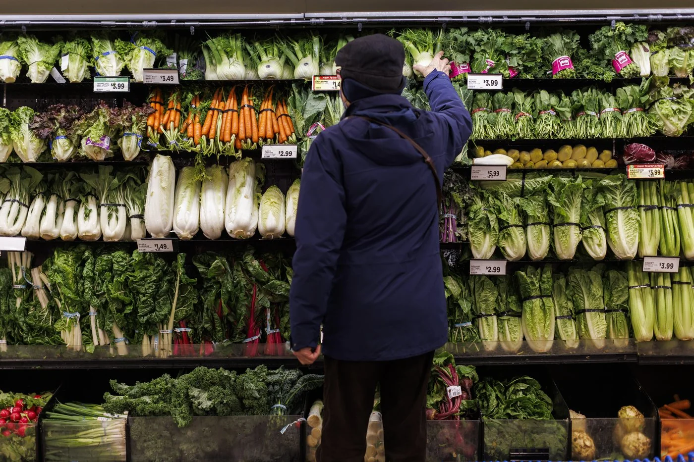 A customer shops in the produce section at a Metro grocery store in Toronto on Friday, Feb. 2, 2024. Food prices in Canada are likely to increase by three to five per cent in 2025, according to a newly released report, but wild cards like climate change and Donald Trump could have unforeseen impacts. THE CANADIAN PRESS/Cole Burston