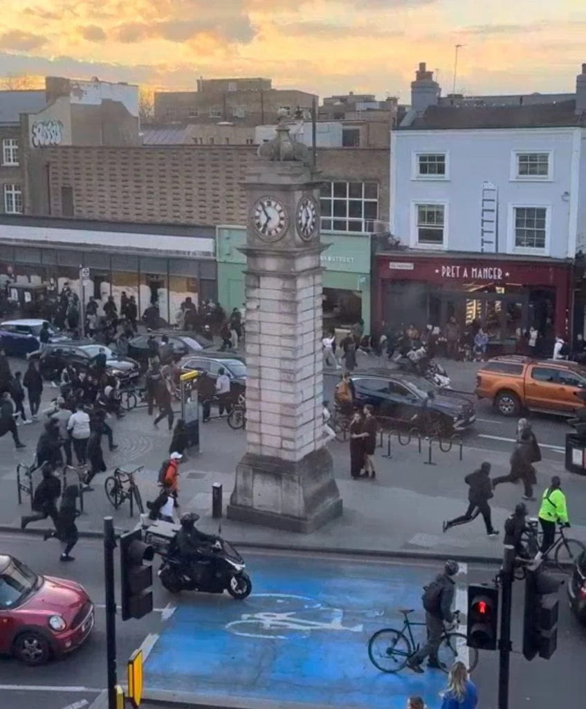 Mayhem: Teenagers seen running down Clapham High Street by local residents | Image credit: Giulia Marchetti