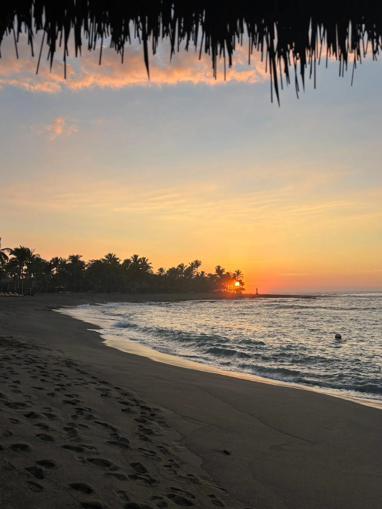 The beach from the Kona Village, A Rosewood Resort shows off Kona's famous sunsets.