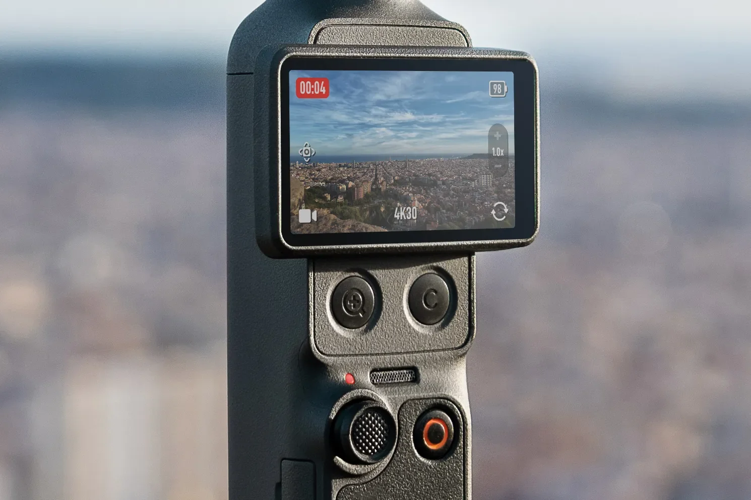 Beneath the Osmo Pocket 4’s rotating screen are two new buttons for zooming or accessing customized settings. Image: DJI