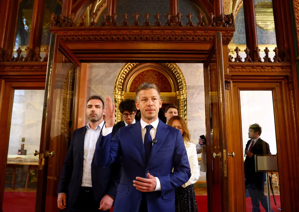 Hungary's election winner Péter Magyar arrives to talk to the media in Hungary's Parliament in Budapest on Friday. Bernadett Szabo/Reuters