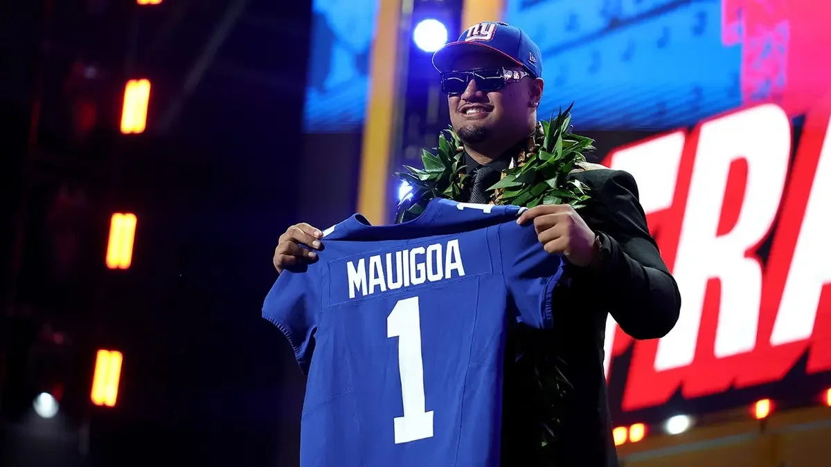 Francis Mauigoa of Miami celebrates after being selected as the tenth overall pick by the New York Giants during the first round of the 2026 NFL Draft at Acrisure Stadium in Pittsburgh, Pa., on April 23, 2026. (Emilee Chinn/Getty Images)