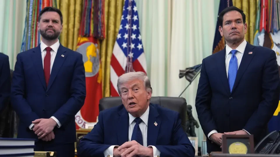 President Donald Trump speaks as Secretary of State Marco Rubio, right, and Vice President JD Vance listen in the Oval Office at the White House, Thursday, April 23, 2026, in Washington. (AP Photo/Mark Schiefelbein)
