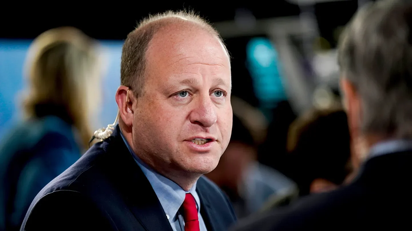 Colorado Gov. Jared Polis speaks to members of the media in the spin room after the first vice presidential debate at the CBS Broadcast Center in New York on Oct. 1, 2024. (Al Drago/Bloomberg)