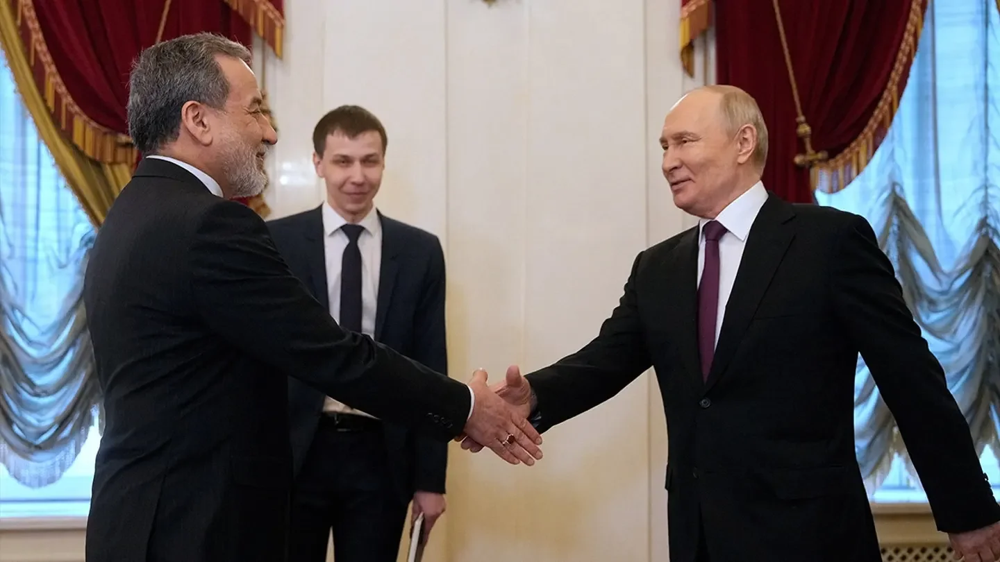 Russian President Vladimir Putin shakes hands with Iranian Foreign Minister Abbas Araqchi during a meeting at the Boris Yeltsin Presidential Library in Saint Petersburg, Russia, April 27, 2026. (Dmitri Lovetsky/Pool via Reuters)