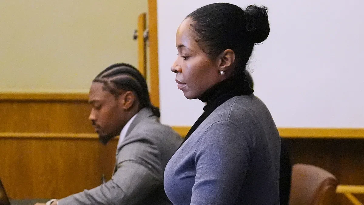 Witness Jamila Adams walks past former New England Patriots wide receiver Stefon Diggs during Diggs' trial at Norfolk County District Court in Dedham, Mass., on May 5, 2026. (Charles Krupa/AP)
