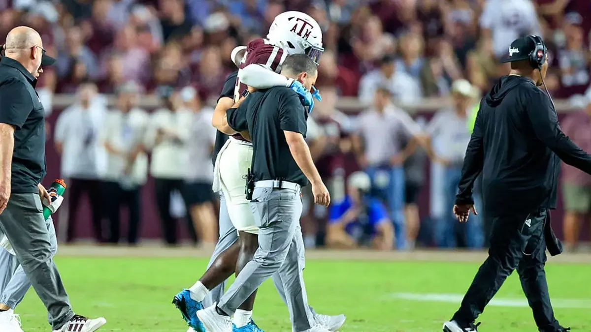 Texas A&M running back Le'Veon Moss is helped off the field during the first half against Florida at Kyle Stadium in College Station, Texas, on Oct. 11, 2025. (Adam Davis/Icon Sportswire)